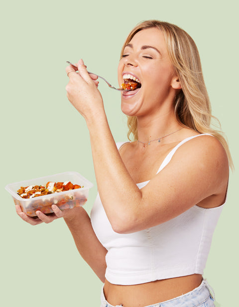 Woman eating Premade Meal Delivery